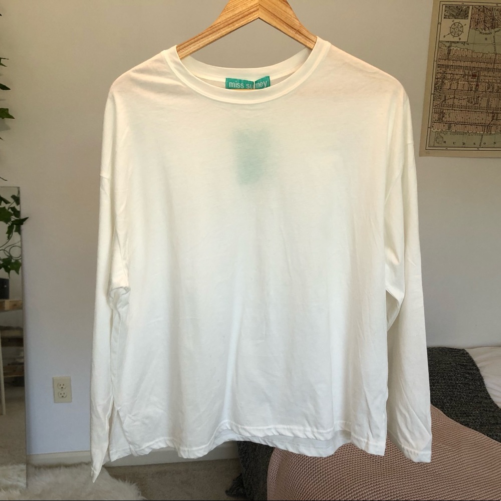white boxy long sleeved tee